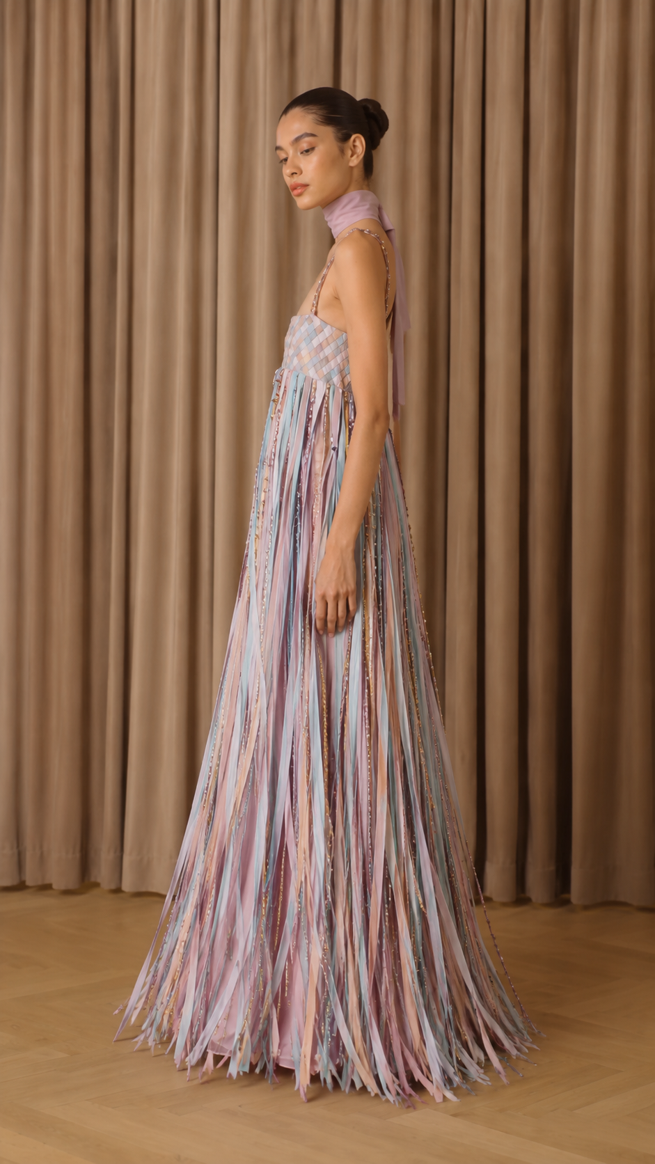 Side view of pastel multi floor-length fringe dress with flowing silhouette