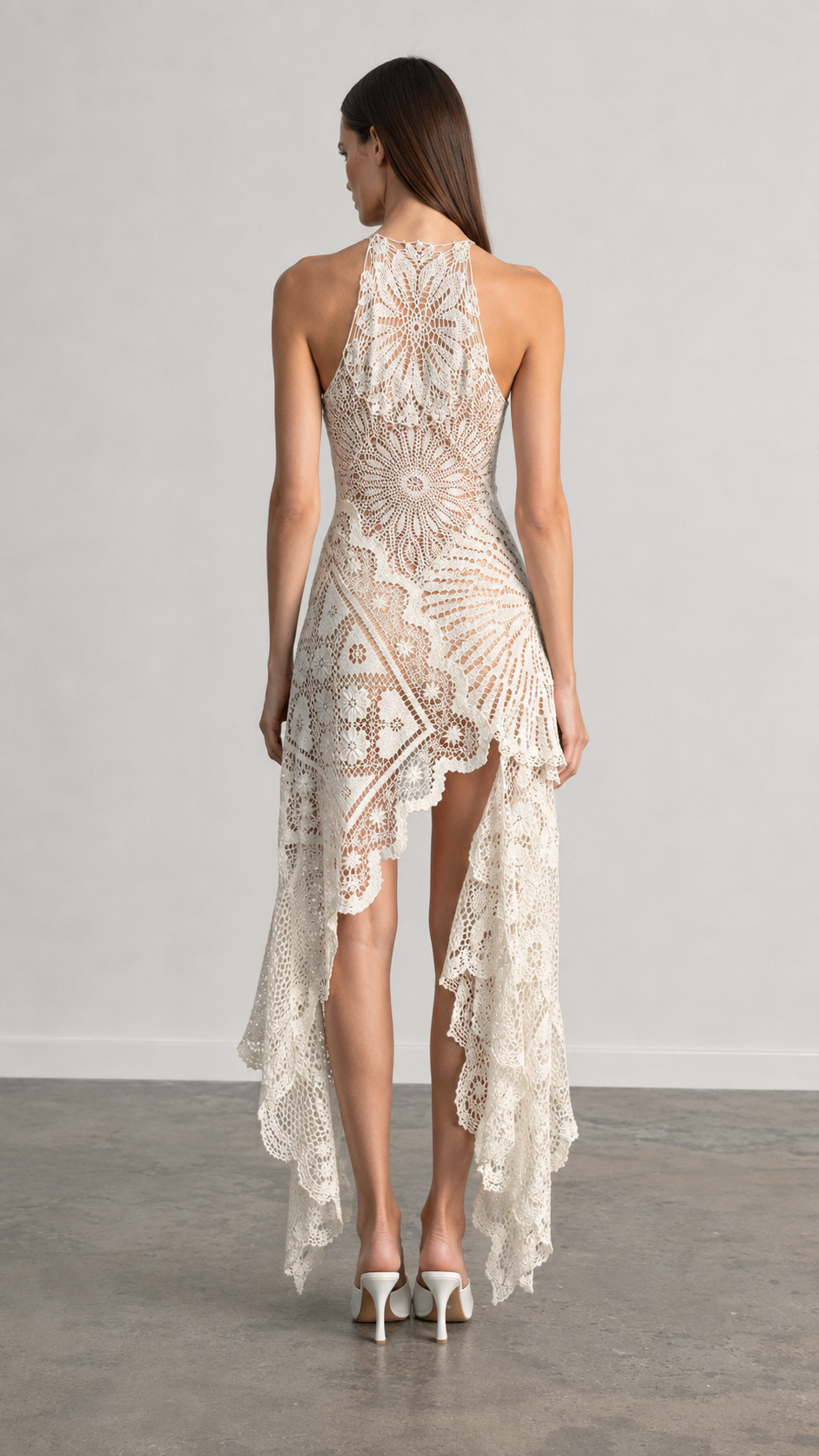 Back view of ivory lace high-low dress with cascading hem