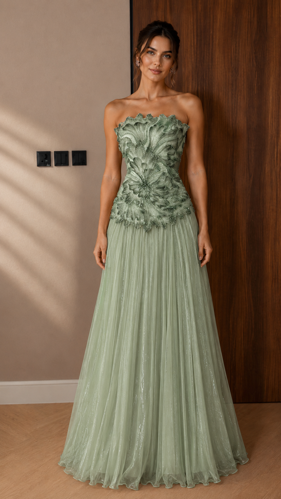 Front view of sage green strapless appliqu¨¦ maxi gown with airy tulle skirt