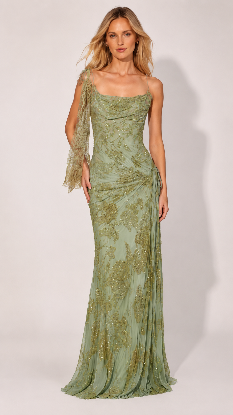 Front view of sage green glitter mesh gown with cowl neckline and sheer scarf detail